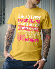 Load image into Gallery viewer, Behind Every Breast Cancer Fighter There Is An Even Stronger Family Guys Tee
