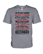 Load image into Gallery viewer, I’m The Crazy Grandma Who Was Born In December Has Fought A Thousand Custom Guys V-Neck
